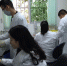 图为疫控中心技术人员正在进行布病检测 - 农业厅