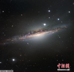 资料图：鲸鱼座NGC1055星系 - 重庆新闻网