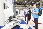 6月21日，展会上的医疗手术机器人，可实现医生远程操控，进行微创医疗手术。 - 重庆新闻网